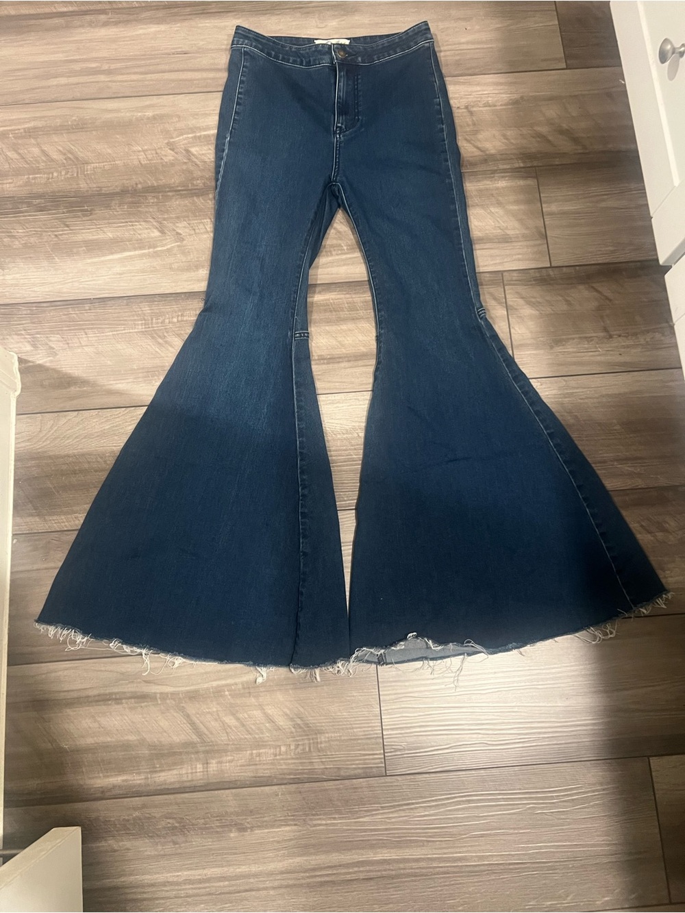 We The Free Dark Blue High-Rise Flare Jeans with Raw Hem